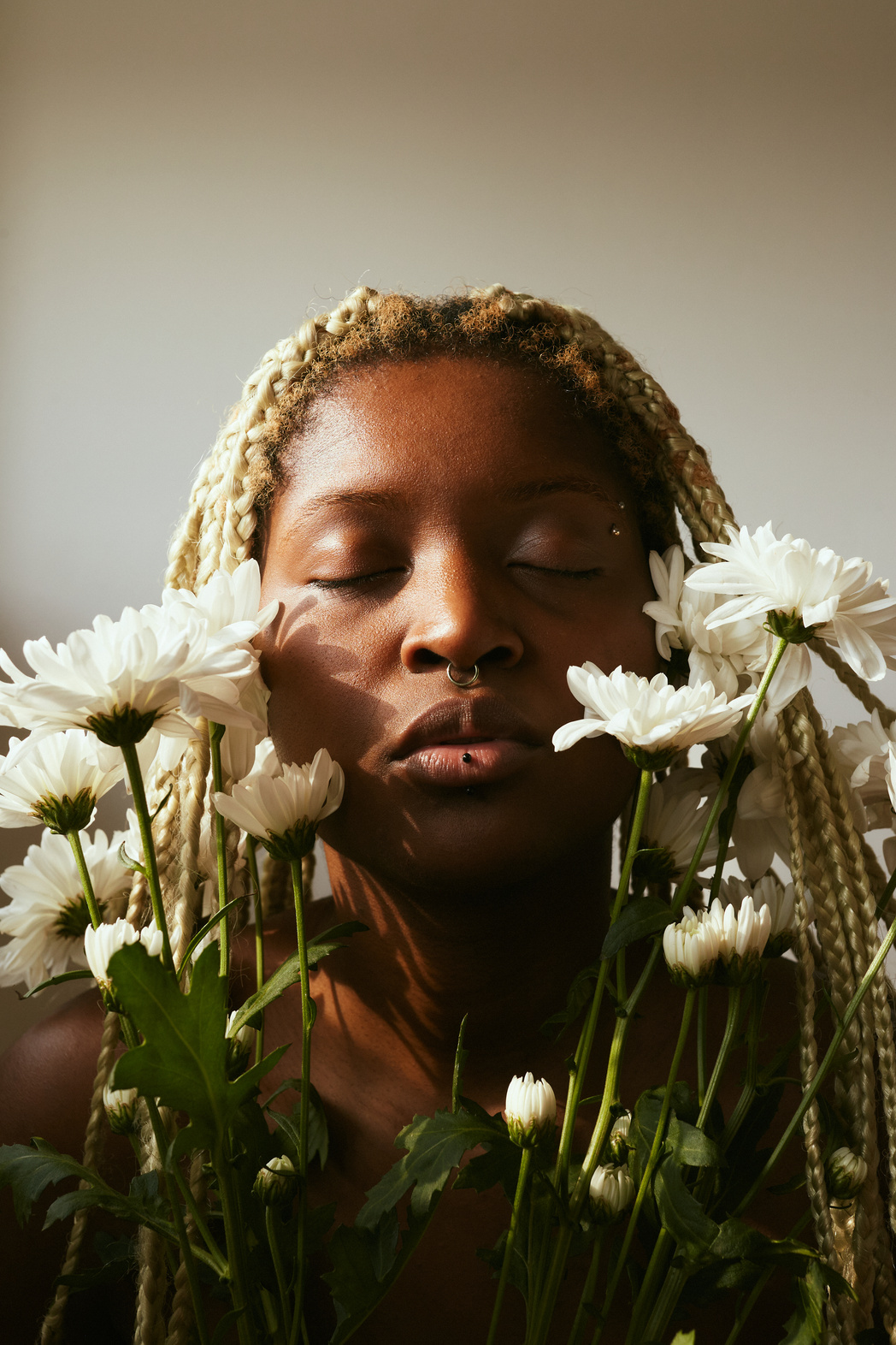 Portrait of Woman with Flowers and Dramatic Lighting